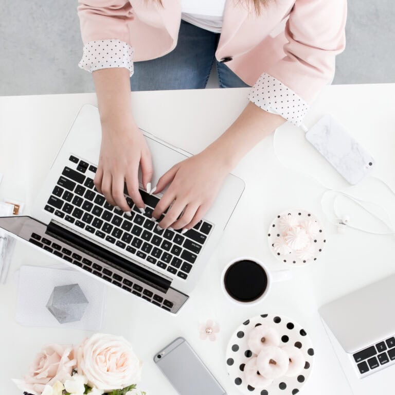 Laptop keyboard and hands of woman working on personal finance or online business, feminine workspace, pink blazer, productivity, financial independence.